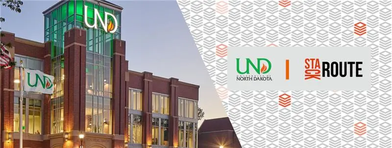 The University of North Dakota (UND) building with green glass windows and banners displaying the UND logo, alongside a partnership graphic featuring the UND and StackRoute logos on a patterned background.